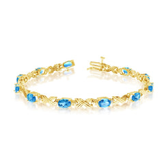 10K Yellow Gold Oval Blue Topaz Stones And Diamonds Tennis Bracelet, 7" - JewelryAffairs
