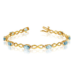 10K Yellow Gold Oval Aquamarine Stones And Diamonds Infinity Tennis Bracelet, 7" fine designer jewelry for men and women