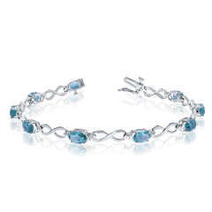 10K White Gold Oval Blue Topaz Stones And Diamonds Infinity Tennis Bracelet, 7" - JewelryAffairs