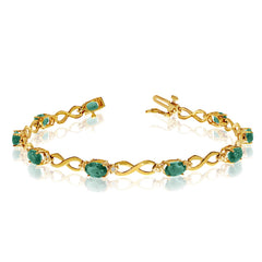 10K Yellow Gold Oval Emerald Stones And Diamonds Infinity Tennis Bracelet, 7" - JewelryAffairs
