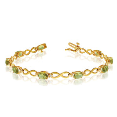 10K Yellow Gold Oval Peridot Stones And Diamonds Infinity Tennis Bracelet, 7" - JewelryAffairs