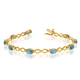 14K Yellow Gold Oval Blue Topaz Stones And Diamonds Infinity Tennis Bracelet, 7"